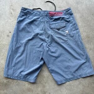 Vintage Oakley software baggy board shorts with the classic software skull